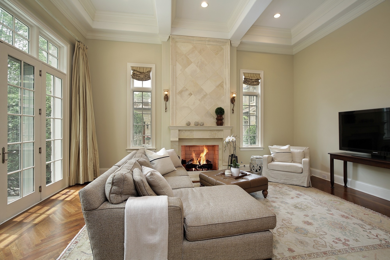 166 Lapier Street Glencoe, IL 60022 - Photo 14 of 32 a living room with furniture a fireplace and a flat screen tv