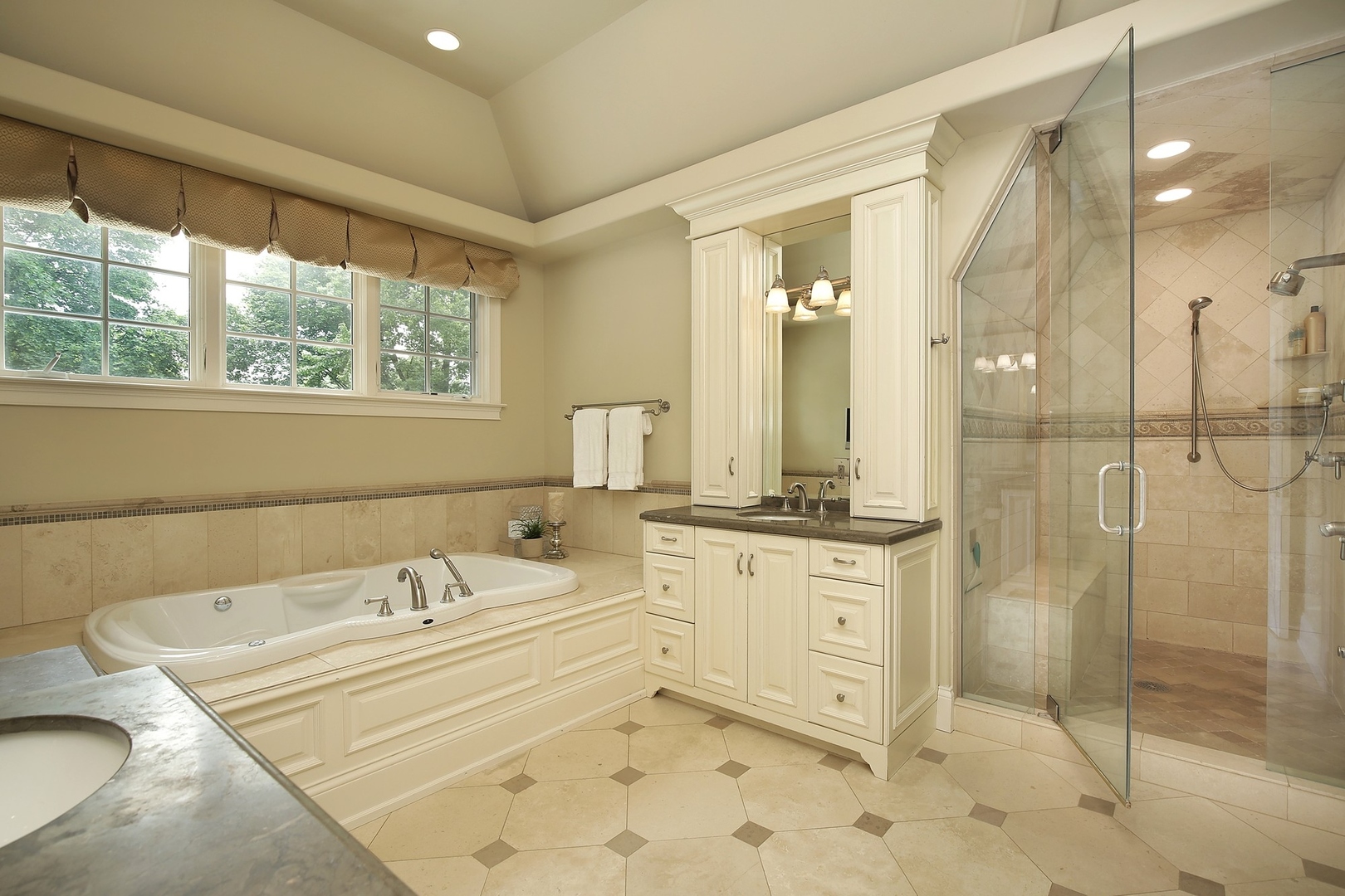 166 Lapier Street Glencoe, IL 60022 - Photo 18 of 32 a bathroom with a granite countertop sink mirror and shower