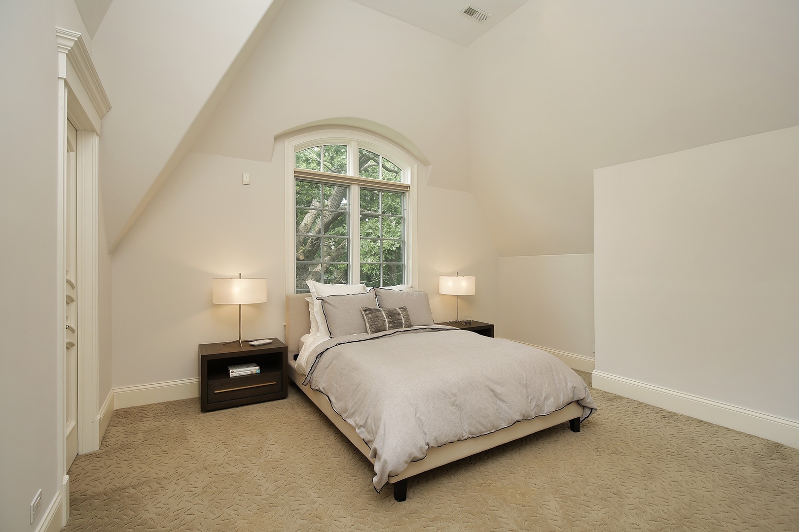 166 Lapier Street Glencoe, IL 60022 - Photo 20 of 32 a bedroom with a bed and a window