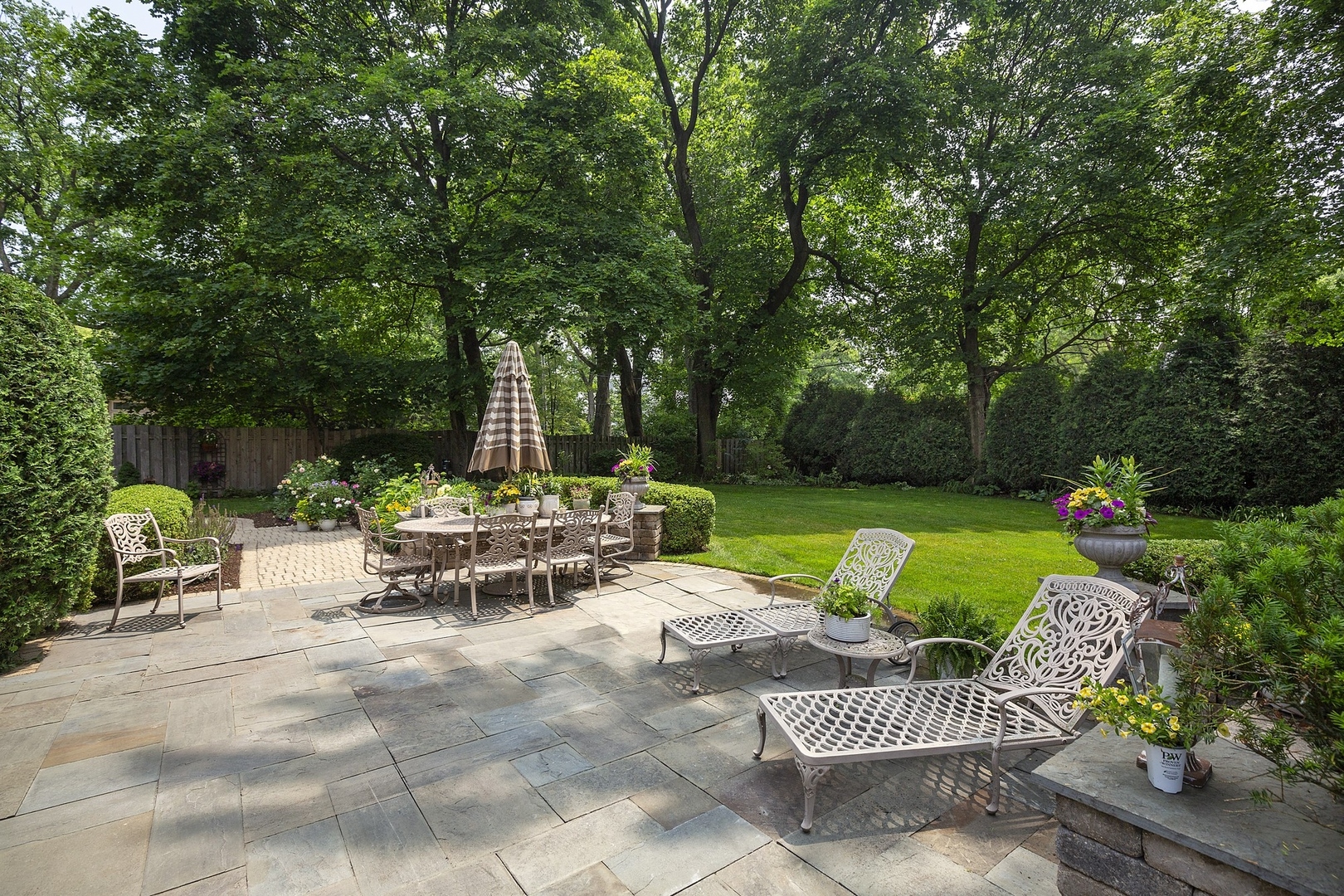 166 Lapier Street Glencoe, IL 60022 - Photo 3 of 32 a view of a table and chairs in the garden