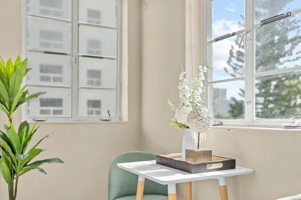 a view of a vase of flowers sitting on a table