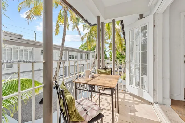 a dining room with furniture water view and windows
