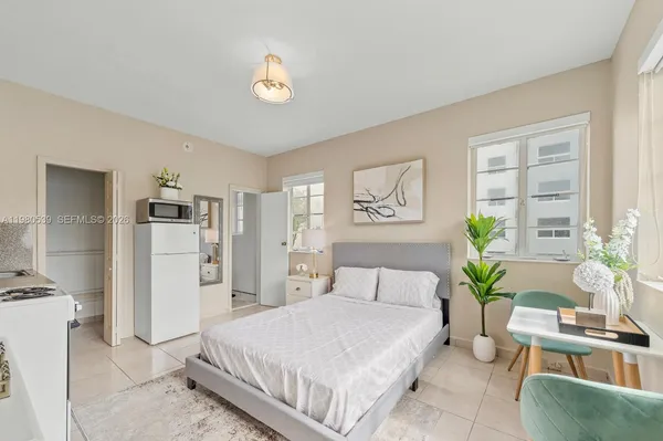 a bed room with a bed and a couch