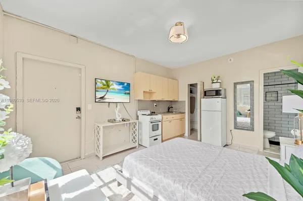 a bed room with a bed and furniture