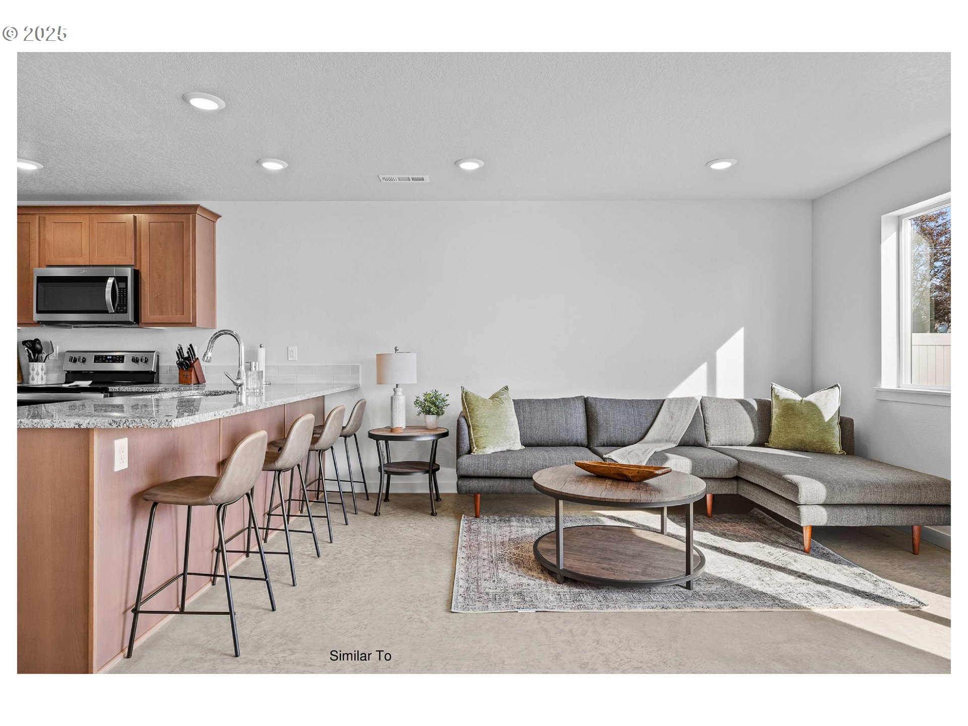 650 Jimmy Street Stanfield, OR 97875 - Photo 13 of 18 a living room with furniture and a flat screen tv