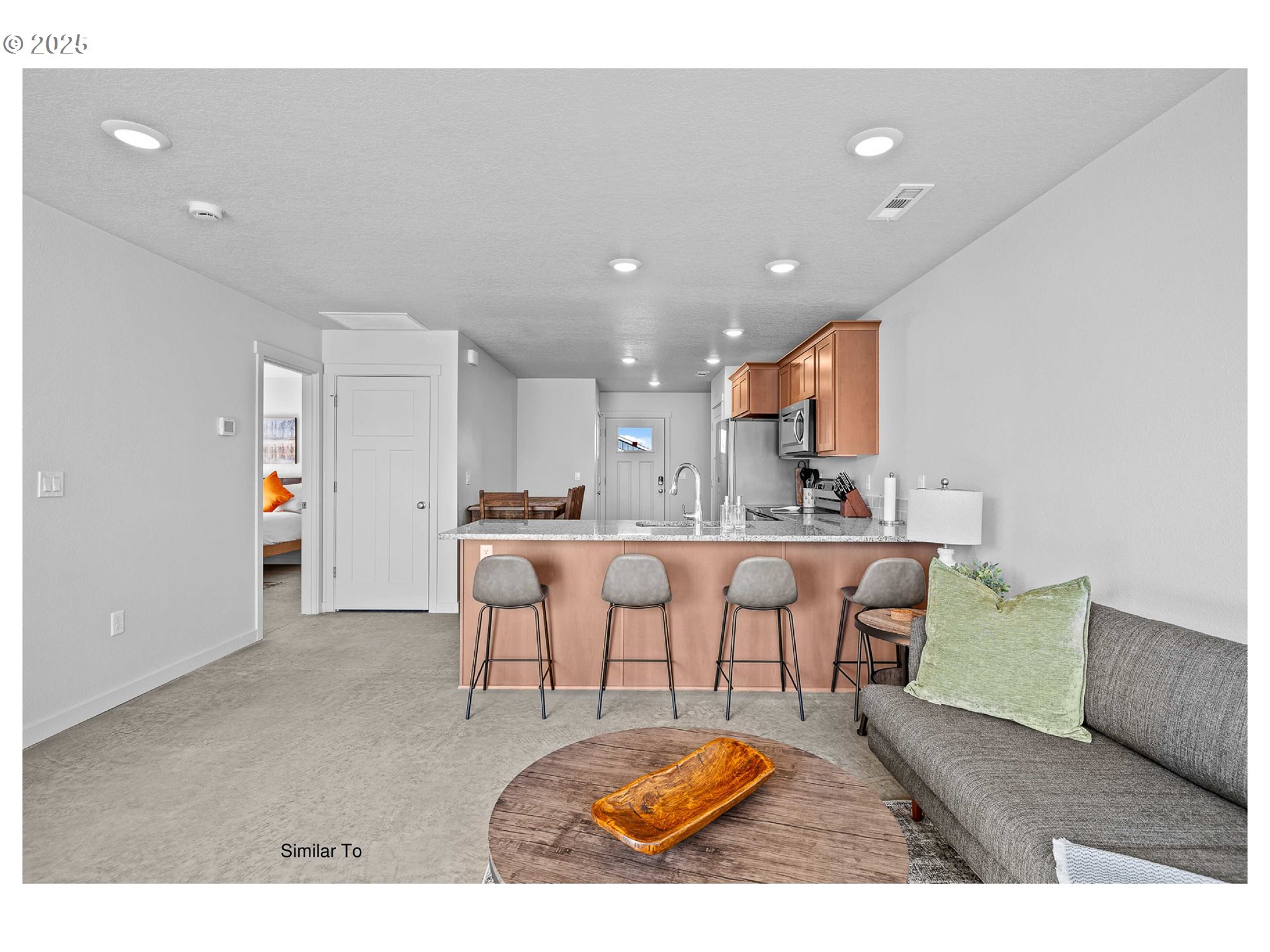 650 Jimmy Street Stanfield, OR 97875 - Photo 16 of 18 a living room with stainless steel appliances kitchen island a table and chairs