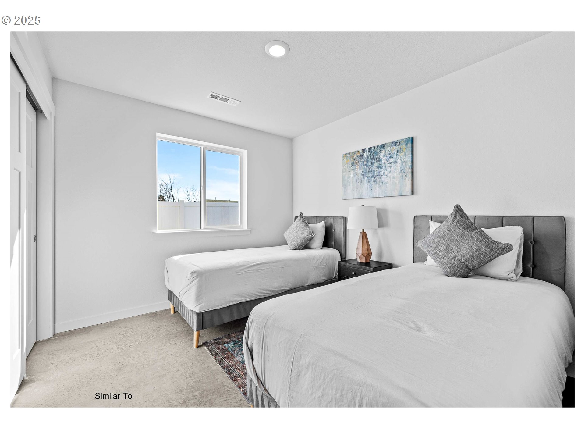 650 Jimmy Street Stanfield, OR 97875 - Photo 5 of 18 a bedroom with two beds and a window