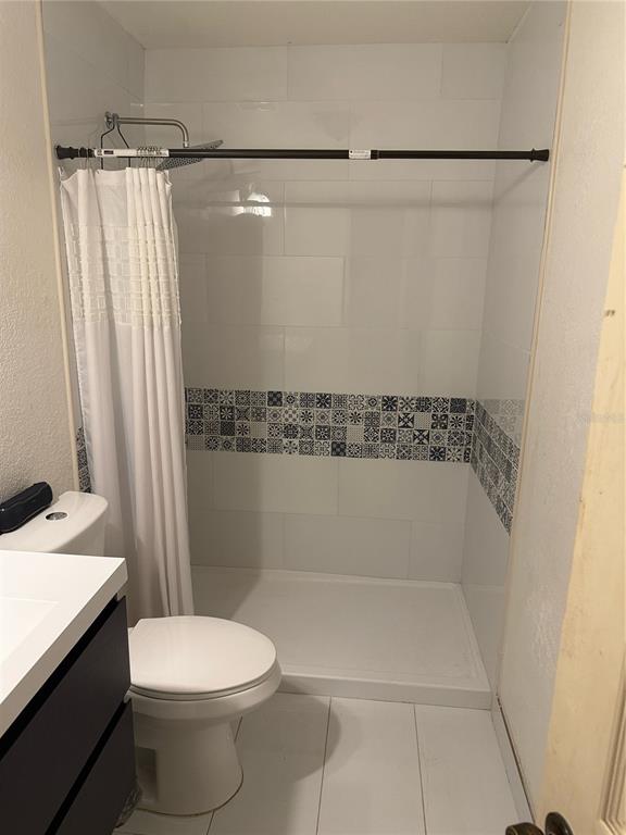 5295 Southeast 28th Street Ocala, FL 34480 - Photo 11 of 11 a bathroom with a shower and a toilet