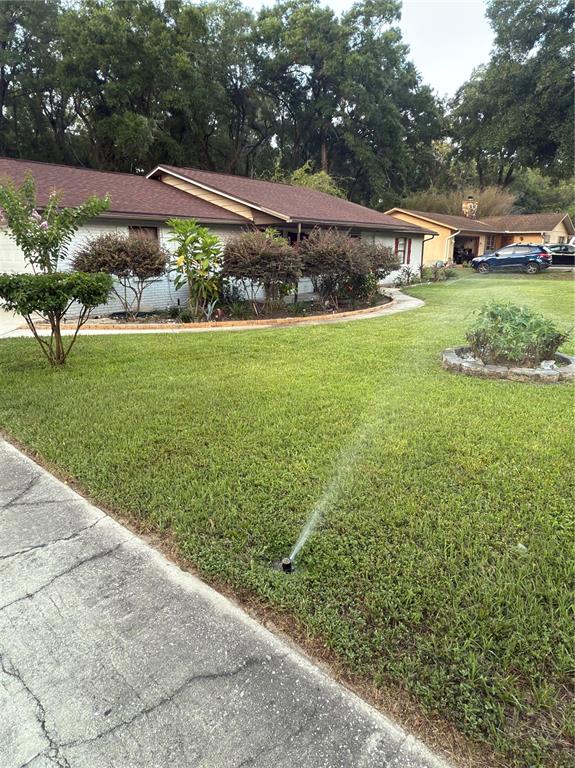 5295 Southeast 28th Street Ocala, FL 34480 - Photo 3 of 11 a view of yard with outdoor seating and green space