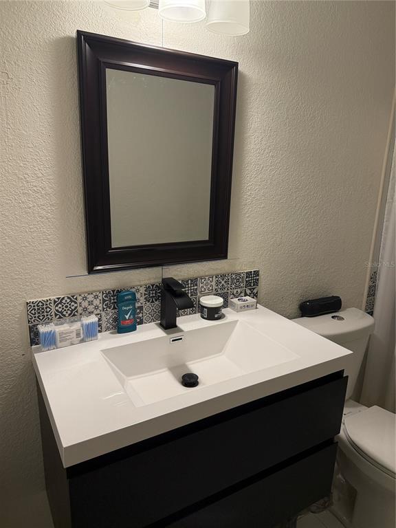 5295 Southeast 28th Street Ocala, FL 34480 - Photo 10 of 11 a bathroom with a sink vanity and a mirror