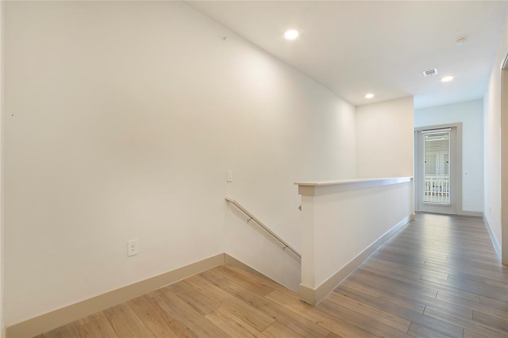 4700 West Spring Creek Parkway, Unit 10102 Plano, TX 75024 - Photo 14 of 20 a view of an empty room with wooden floor