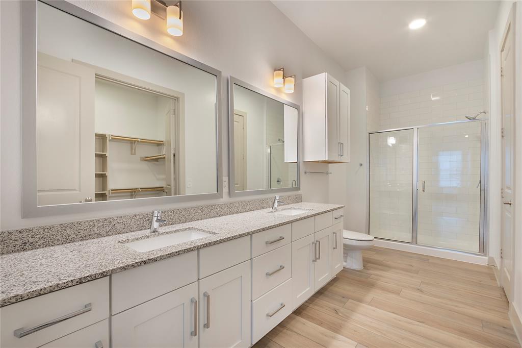 4700 West Spring Creek Parkway, Unit 10102 Plano, TX 75024 - Photo 16 of 20 a bathroom with double sink and a mirror