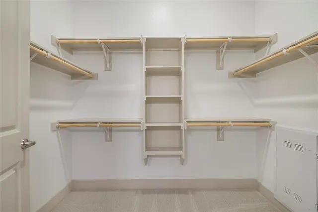 a view of an empty walk in closet