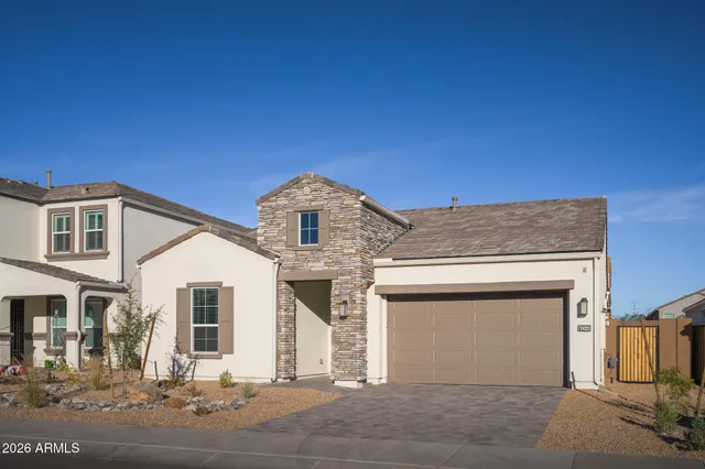 a front view of a house with a garage
