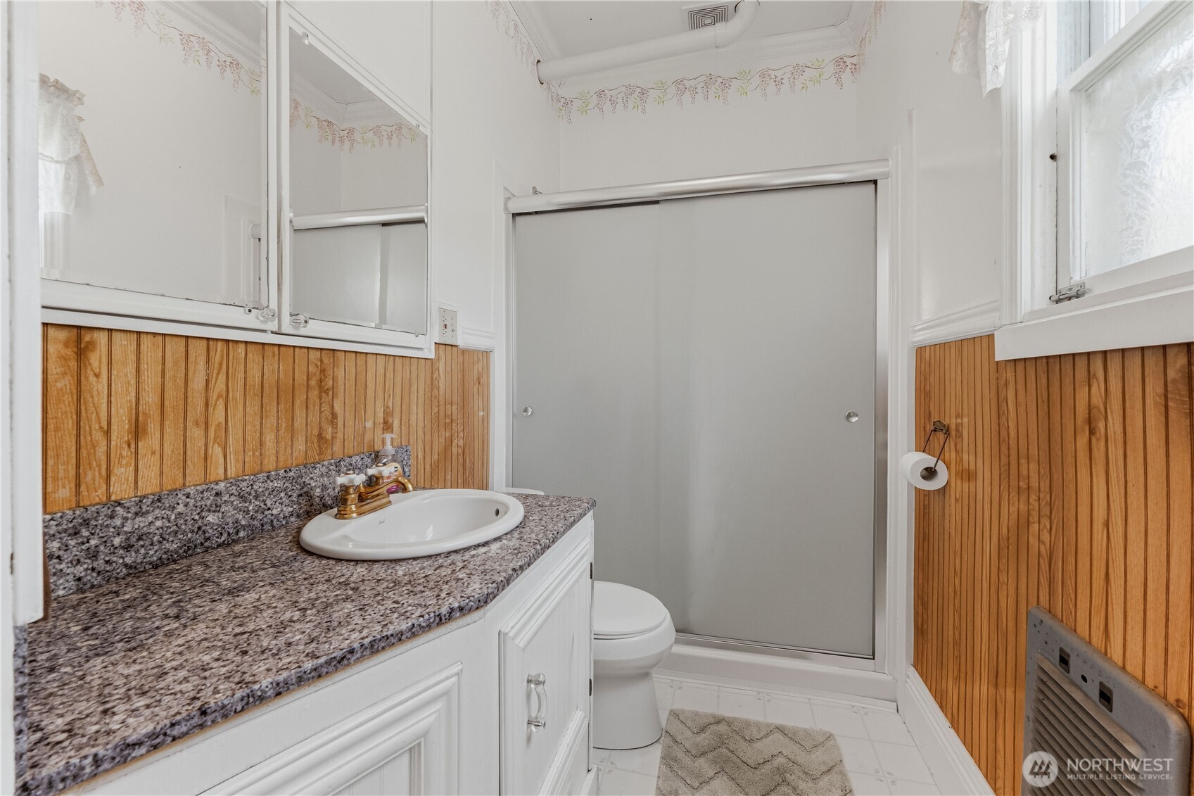 5601 Airport Road Cashmere, WA 98815 - Photo 11 of 36 a bathroom with a granite countertop sink and a mirror