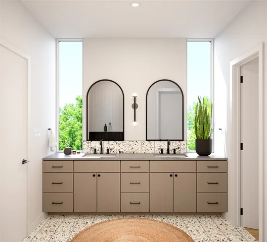 a bathroom with a double vanity sink and mirror
