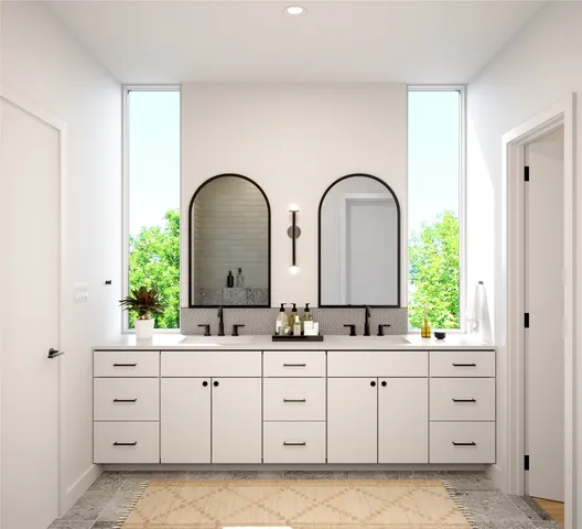 a bathroom with a double vanity sink and mirror