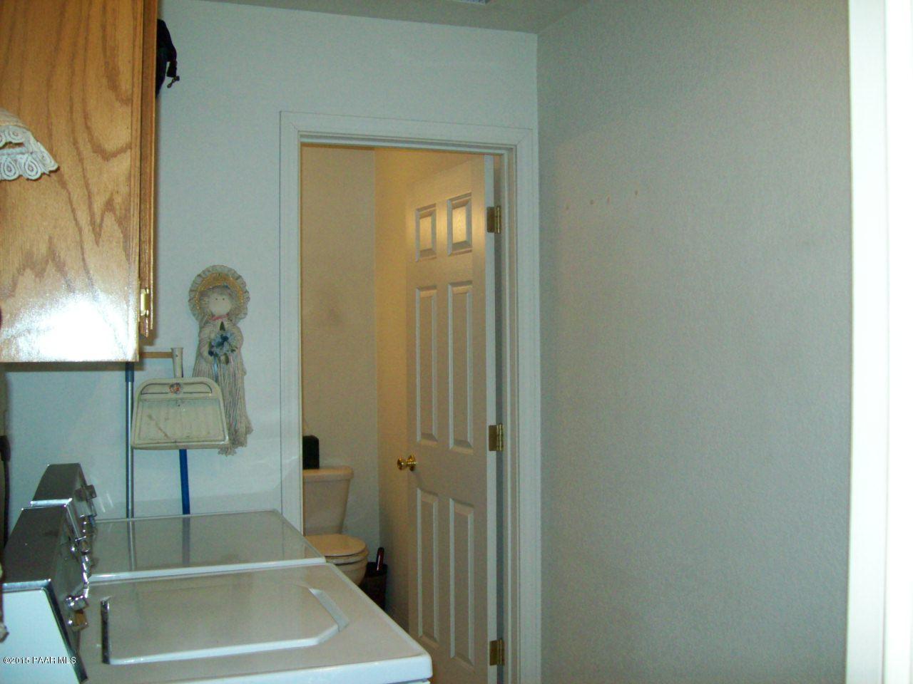 1860 North Moon Shadow Road Chino Valley, AZ 86323 - Photo 14 of 28 laundry room with half bath
