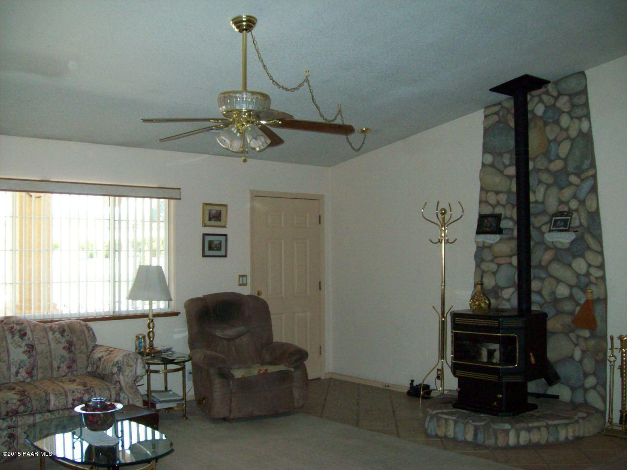 1860 North Moon Shadow Road Chino Valley, AZ 86323 - Photo 5 of 28 livingroom with pellet stove
