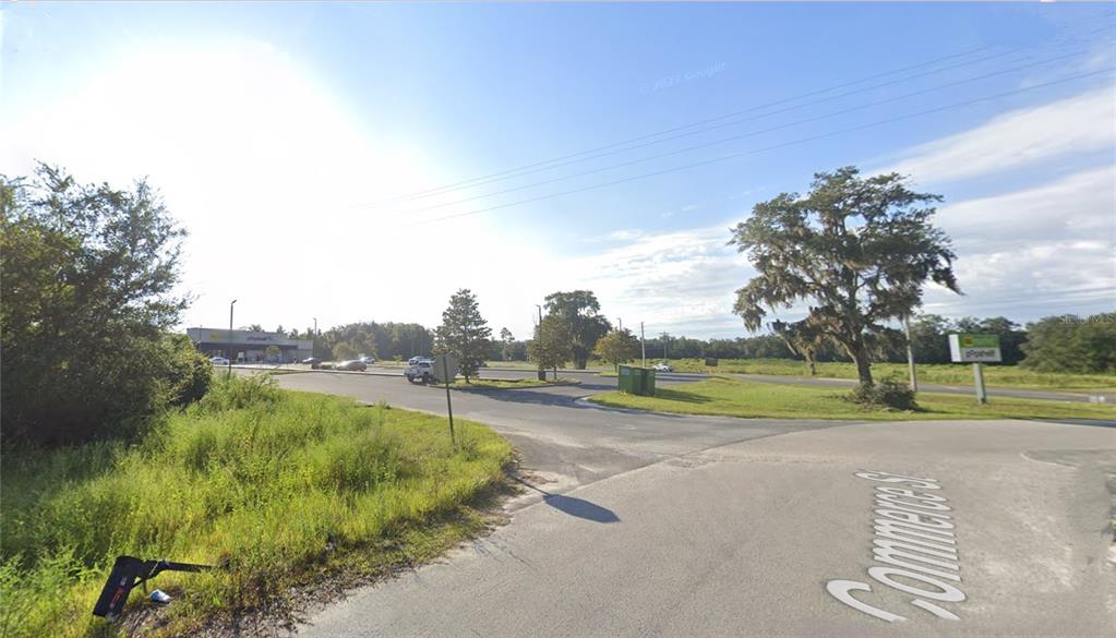 Tbd Commerce Street Bronson, FL 32621 - Photo 9 of 11 a view of a golf course with a lake