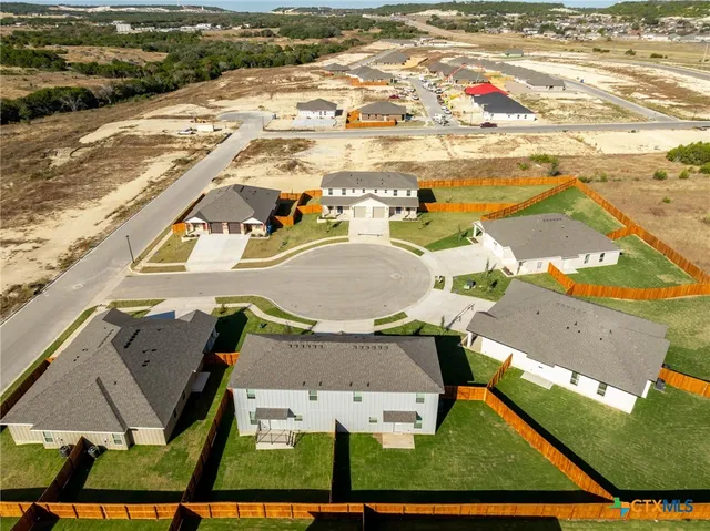 an aerial view of a house with a ocean view
