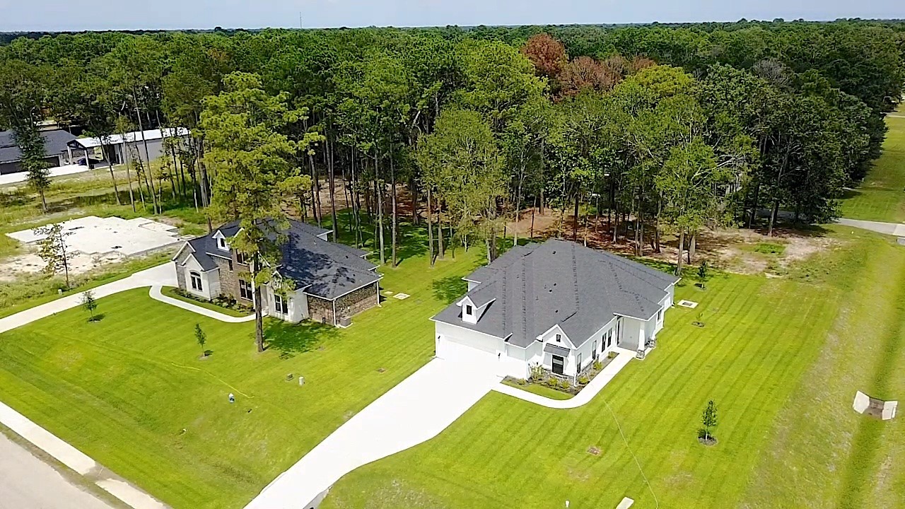 a view of a swimming pool with a yard