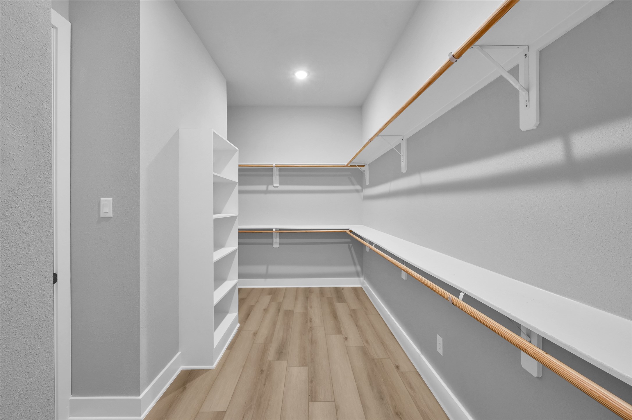 28502 Tallow Rock Lane Huffman, TX 77336 - Photo 18 of 30 a view of a hallway with wooden floor and staircase