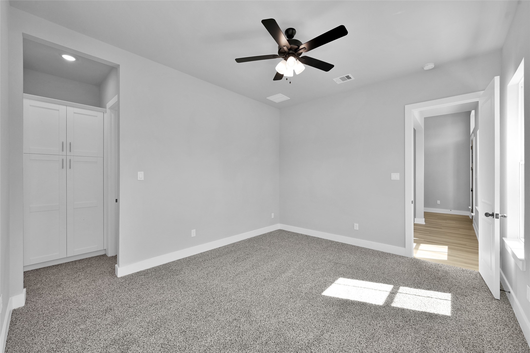 28502 Tallow Rock Lane Huffman, TX 77336 - Photo 21 of 30 an empty room with closet and a ceiling fan