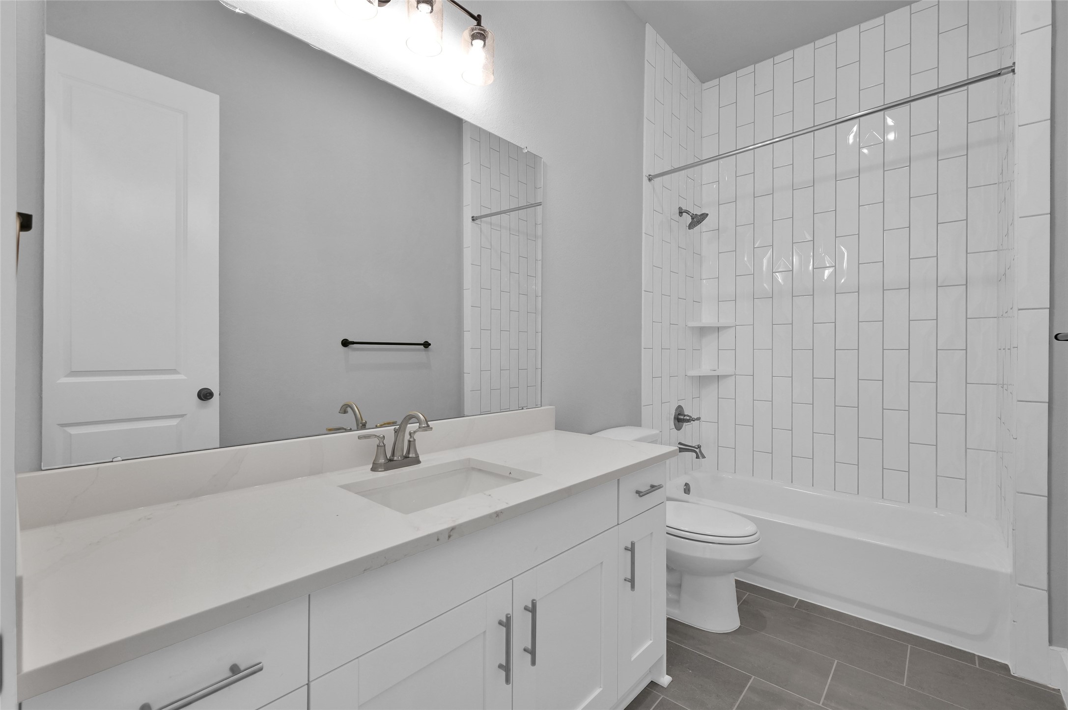 28502 Tallow Rock Lane Huffman, TX 77336 - Photo 23 of 30 a bathroom with a bathtub shower sink mirror and toilet