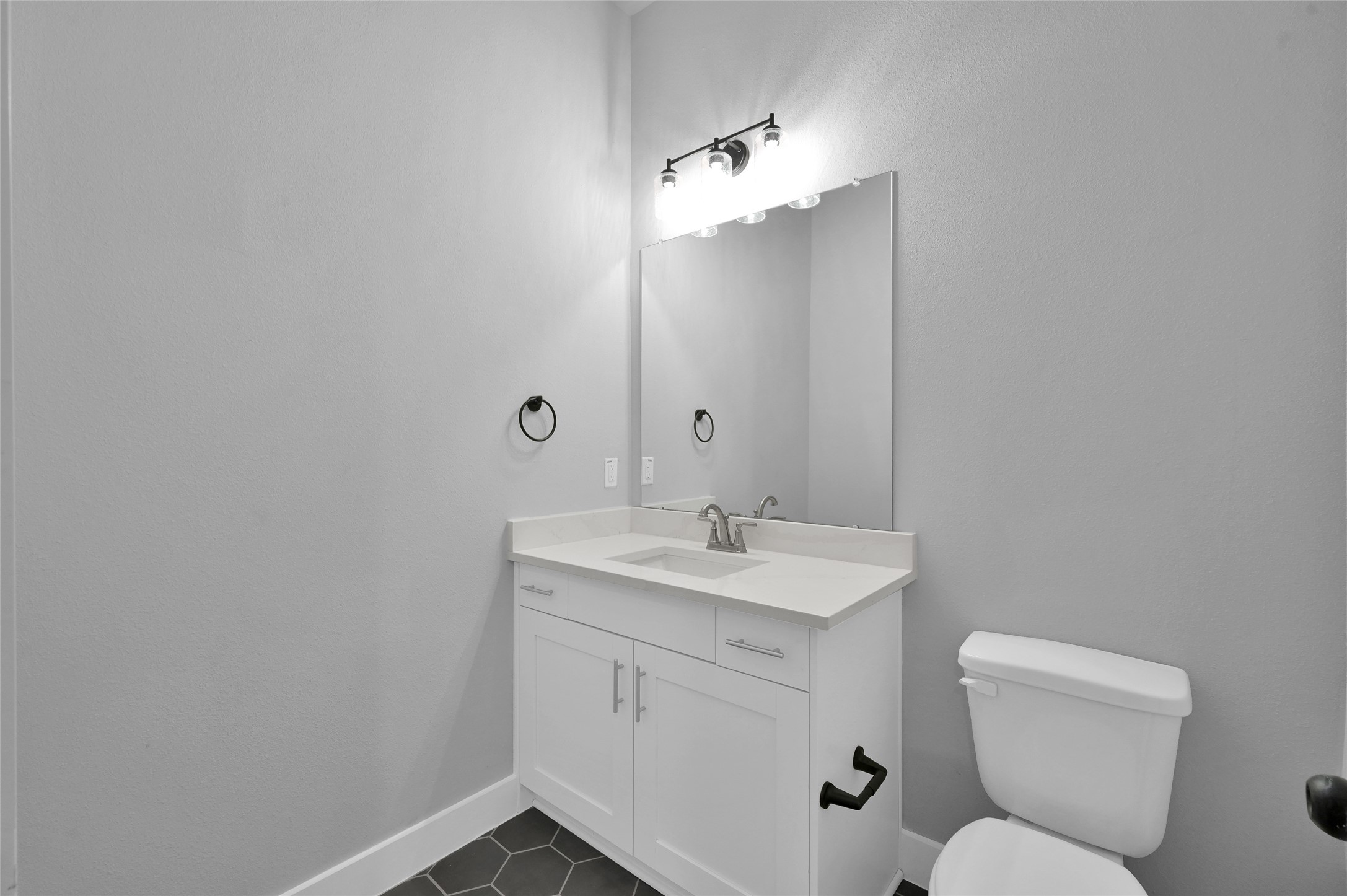 28502 Tallow Rock Lane Huffman, TX 77336 - Photo 25 of 30 a bathroom with a toilet sink and mirror