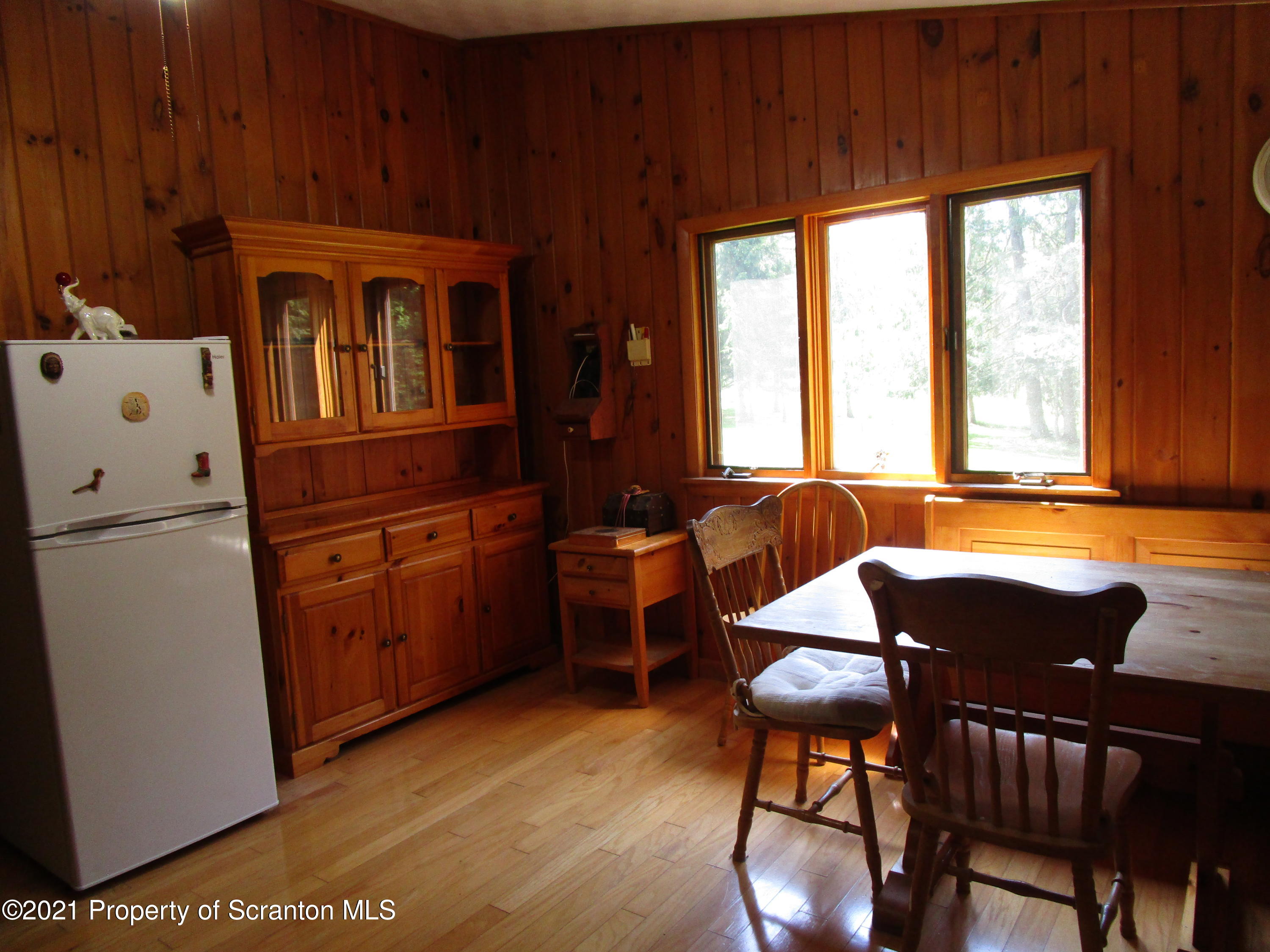 1709 Mill Creek Road Le Raysville, PA 18829 - Photo 16 of 41 a kitchen with table chairs and refrigerator