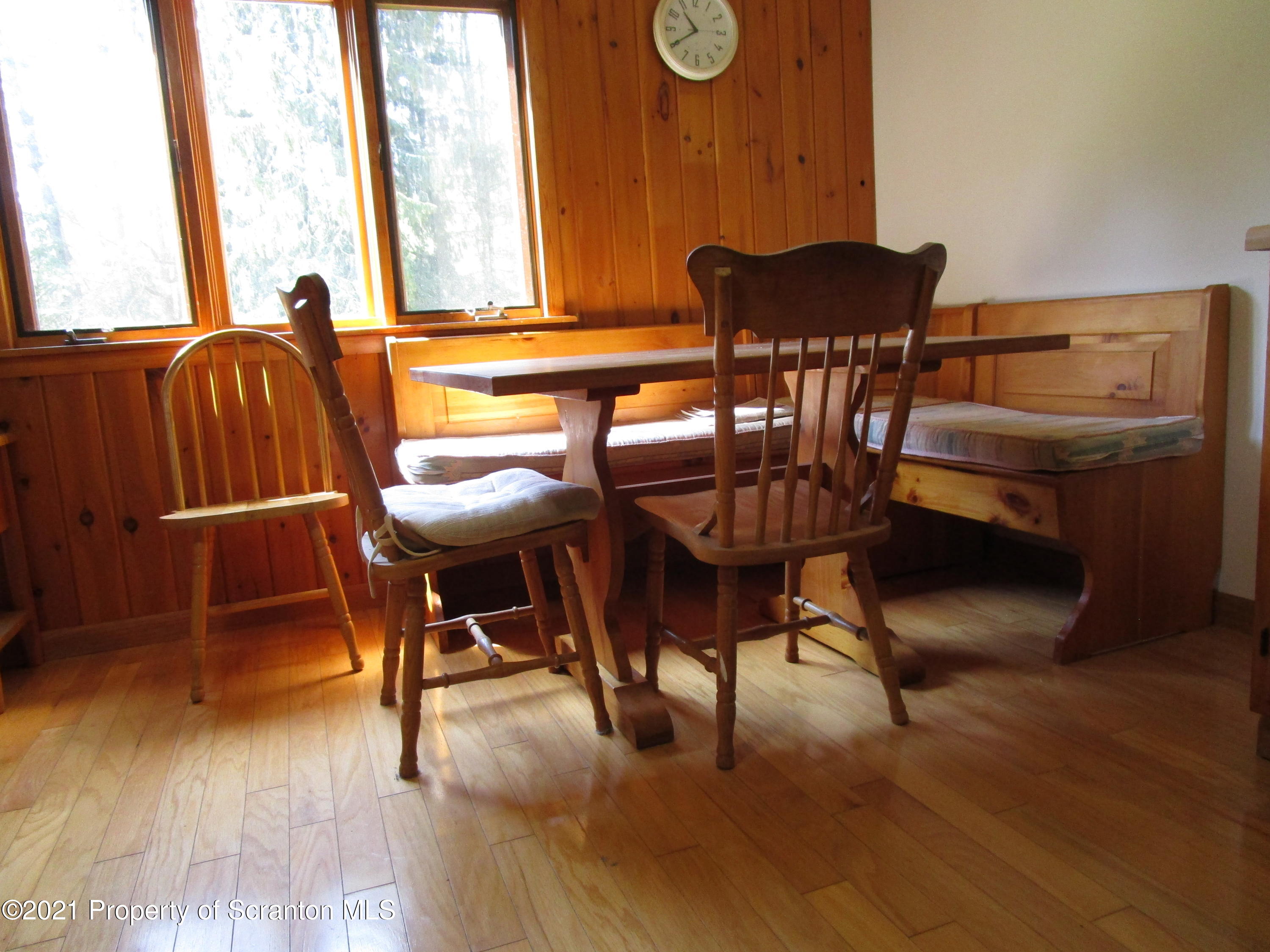 1709 Mill Creek Road Le Raysville, PA 18829 - Photo 17 of 41 a view of a dining room with furniture and a large window
