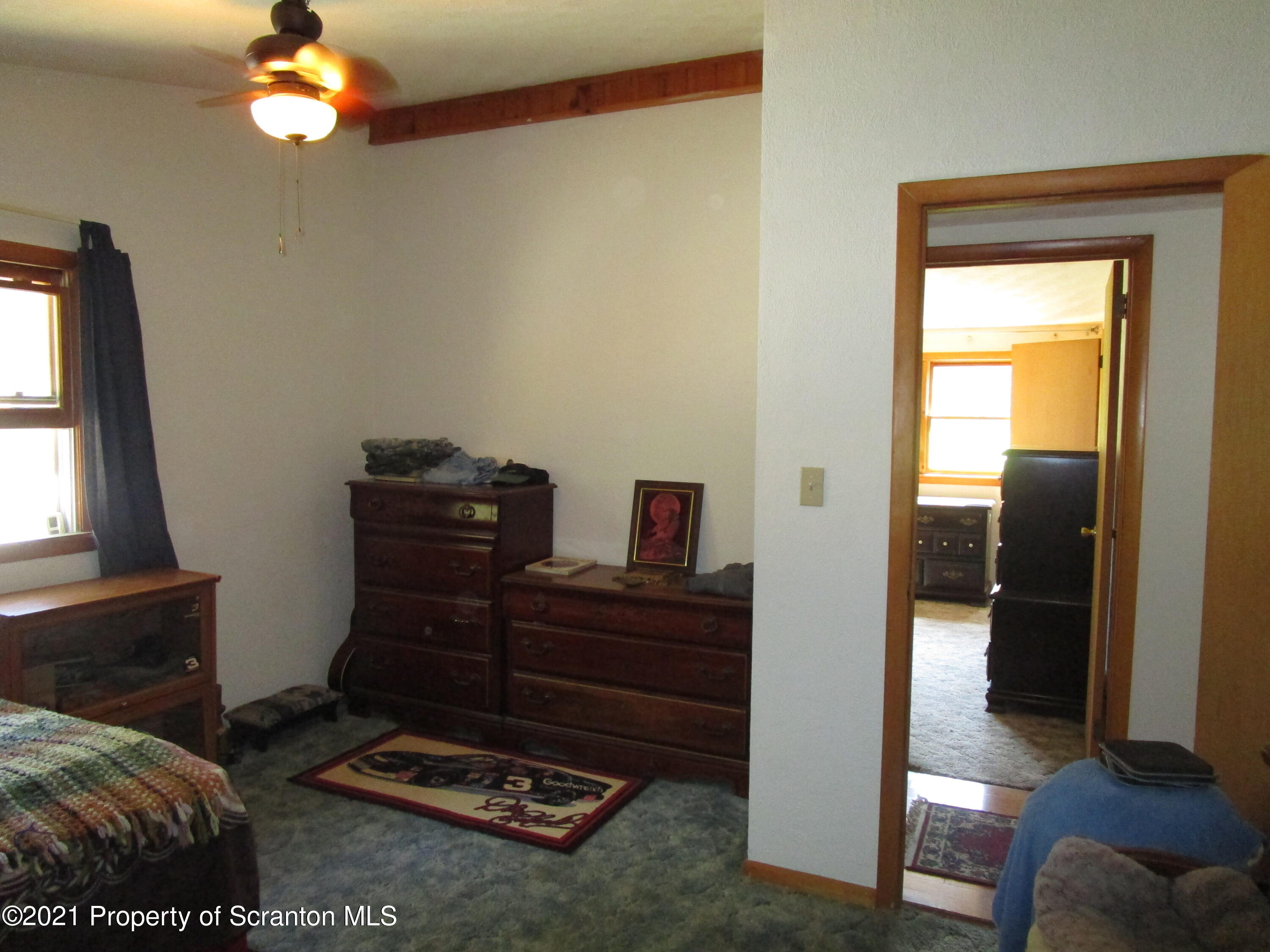 1709 Mill Creek Road Le Raysville, PA 18829 - Photo 19 of 41 a view of a livingroom with furniture and a window
