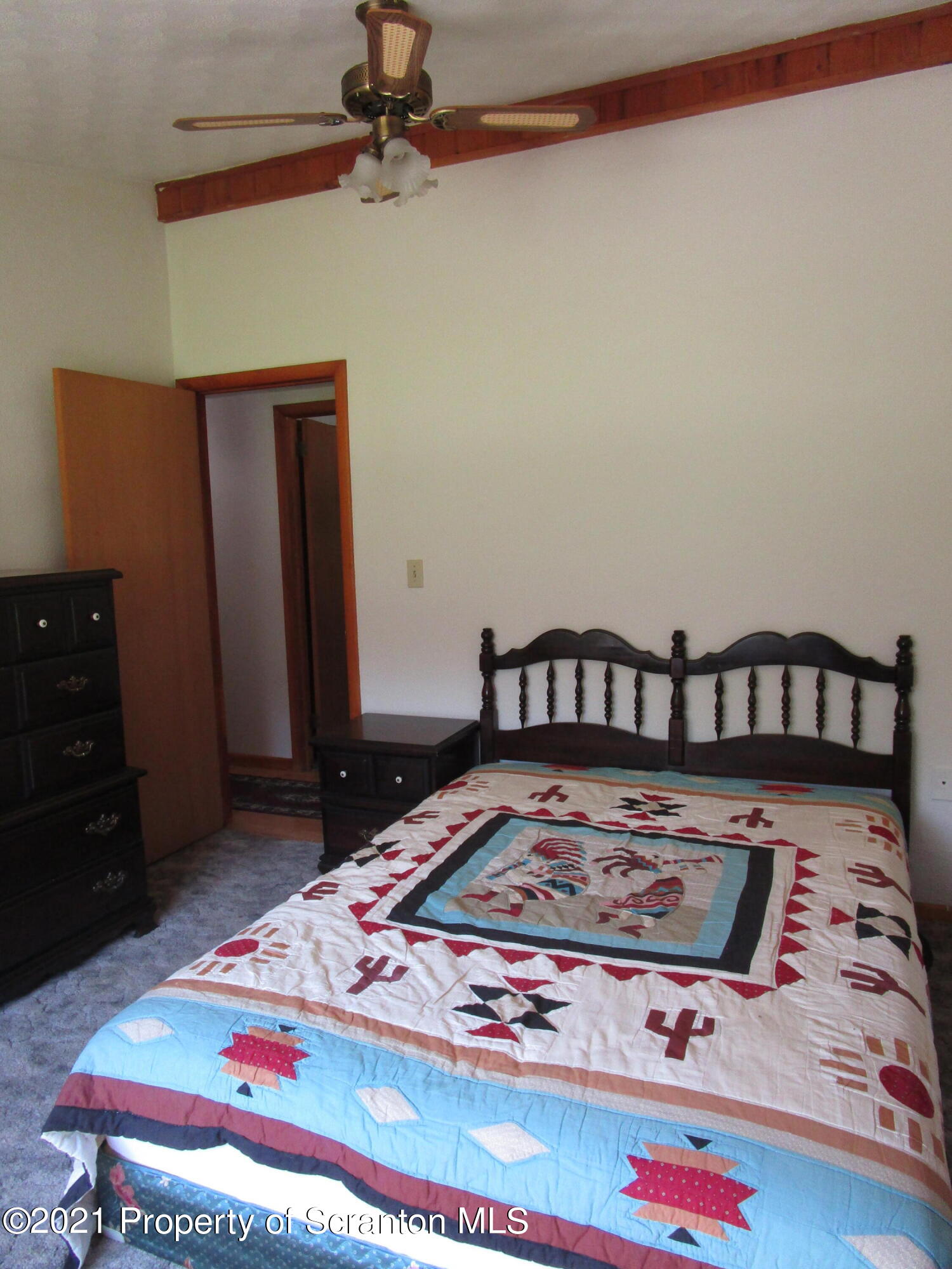 1709 Mill Creek Road Le Raysville, PA 18829 - Photo 23 of 41 a bed sitting in a bedroom next to a window
