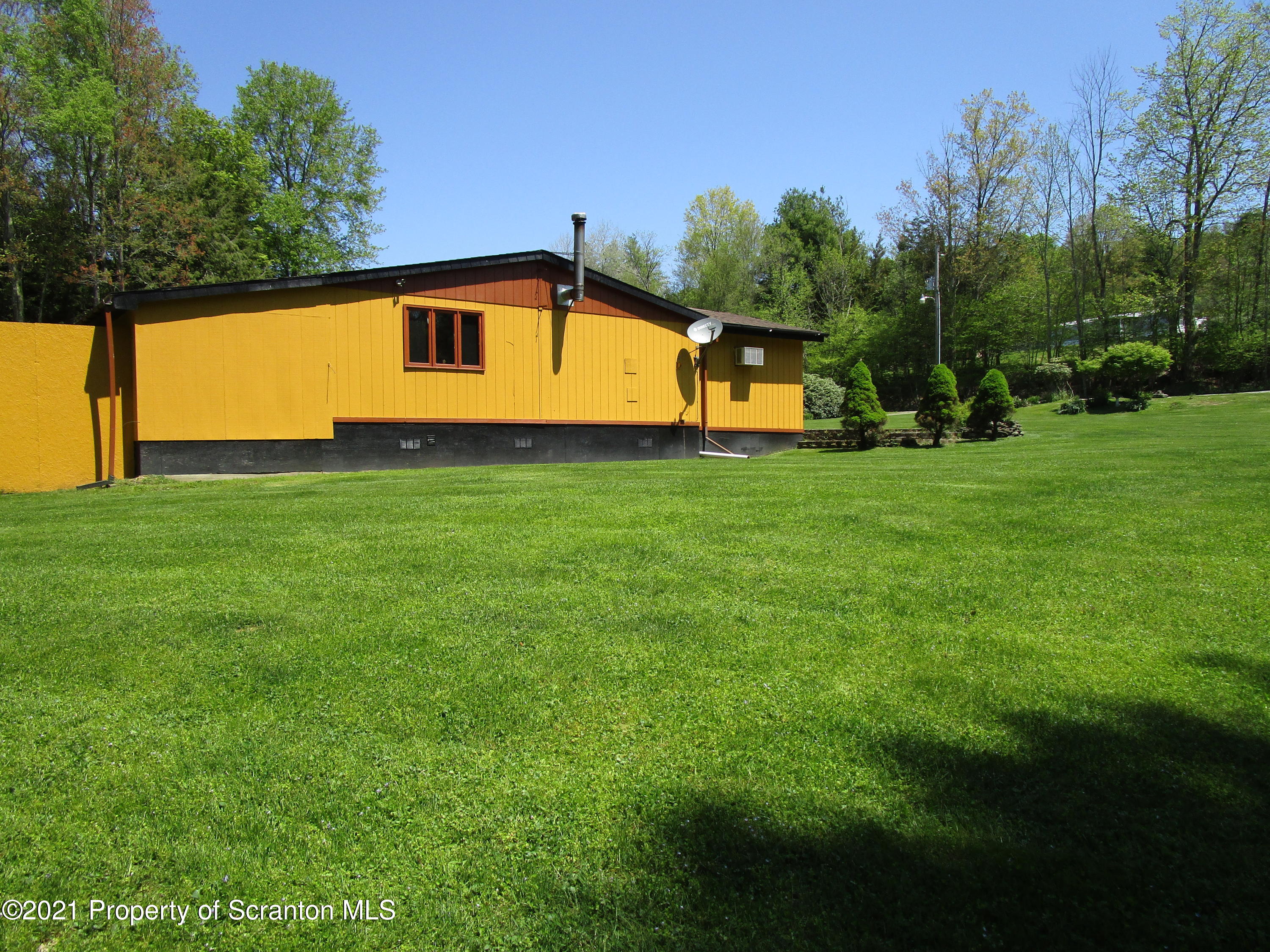 1709 Mill Creek Road Le Raysville, PA 18829 - Photo 33 of 41 a front view of a house with a yard