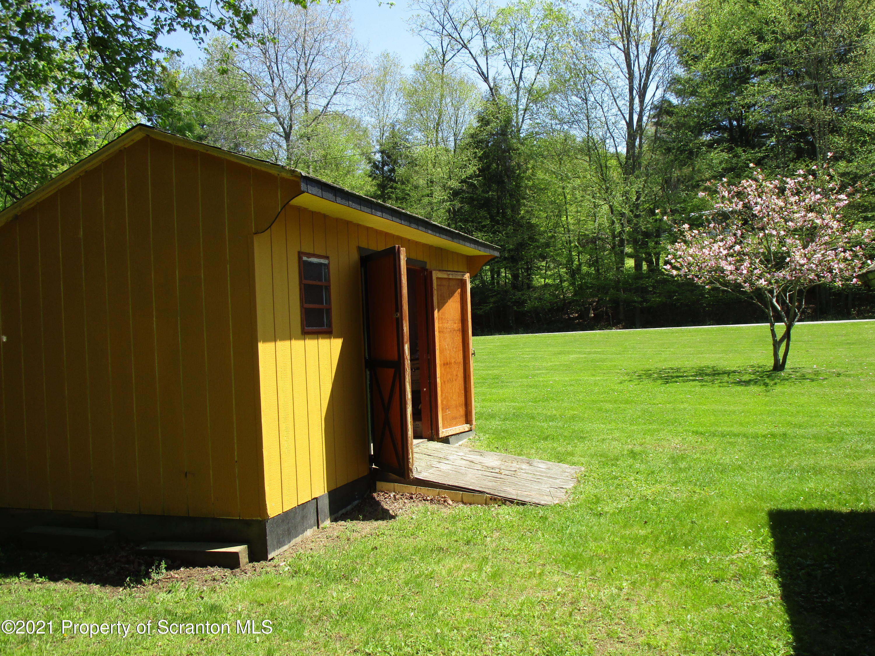 1709 Mill Creek Road Le Raysville, PA 18829 - Photo 40 of 41 a view of a backyard with small cabin