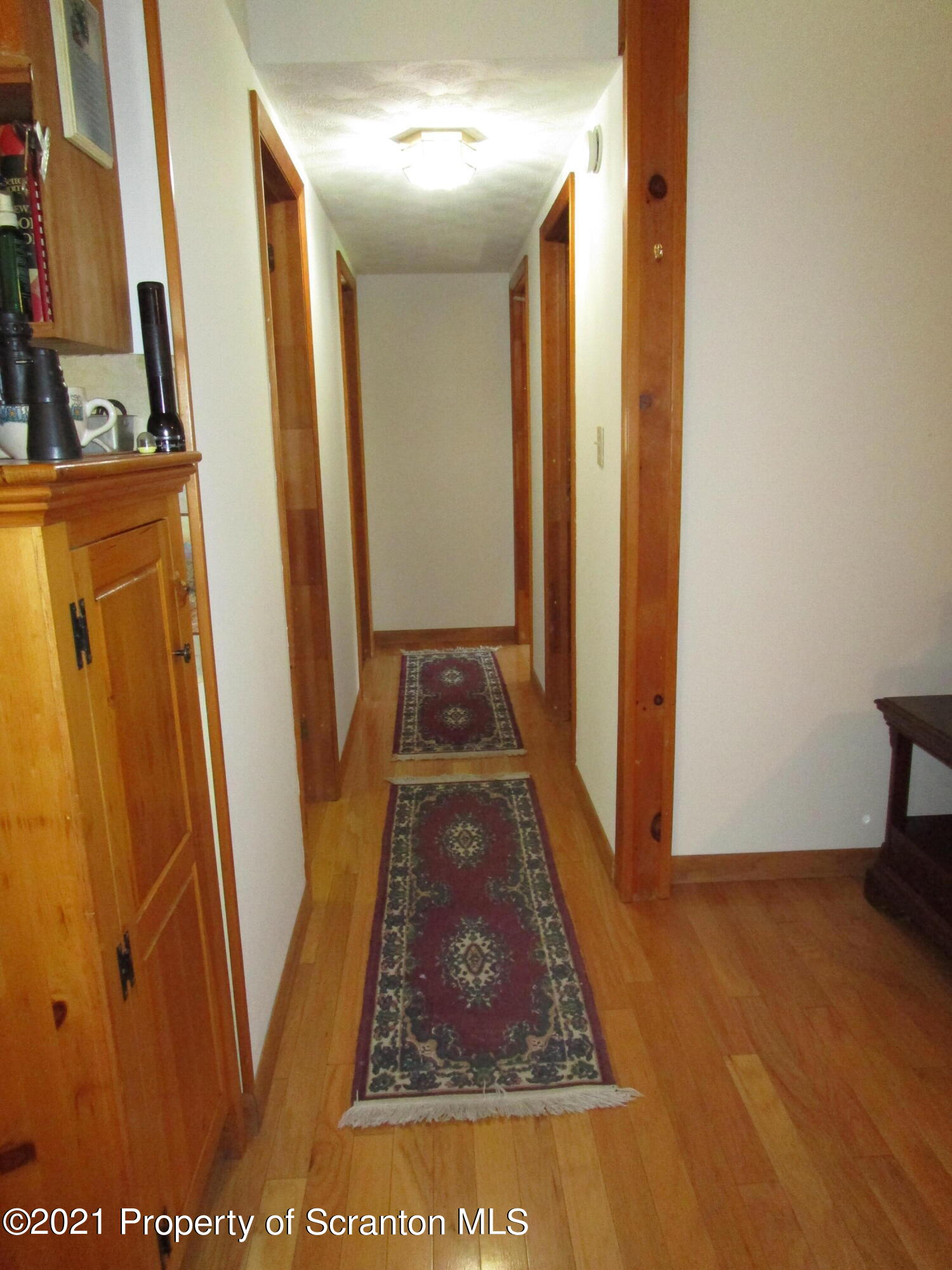 1709 Mill Creek Road Le Raysville, PA 18829 - Photo 41 of 41 a view of a hallway with wooden floor