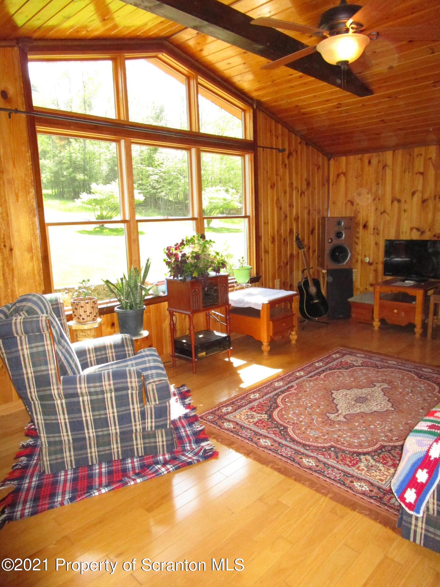 1709 Mill Creek Road Le Raysville, PA 18829 - Photo 9 of 41 a living room with furniture tv and a large window