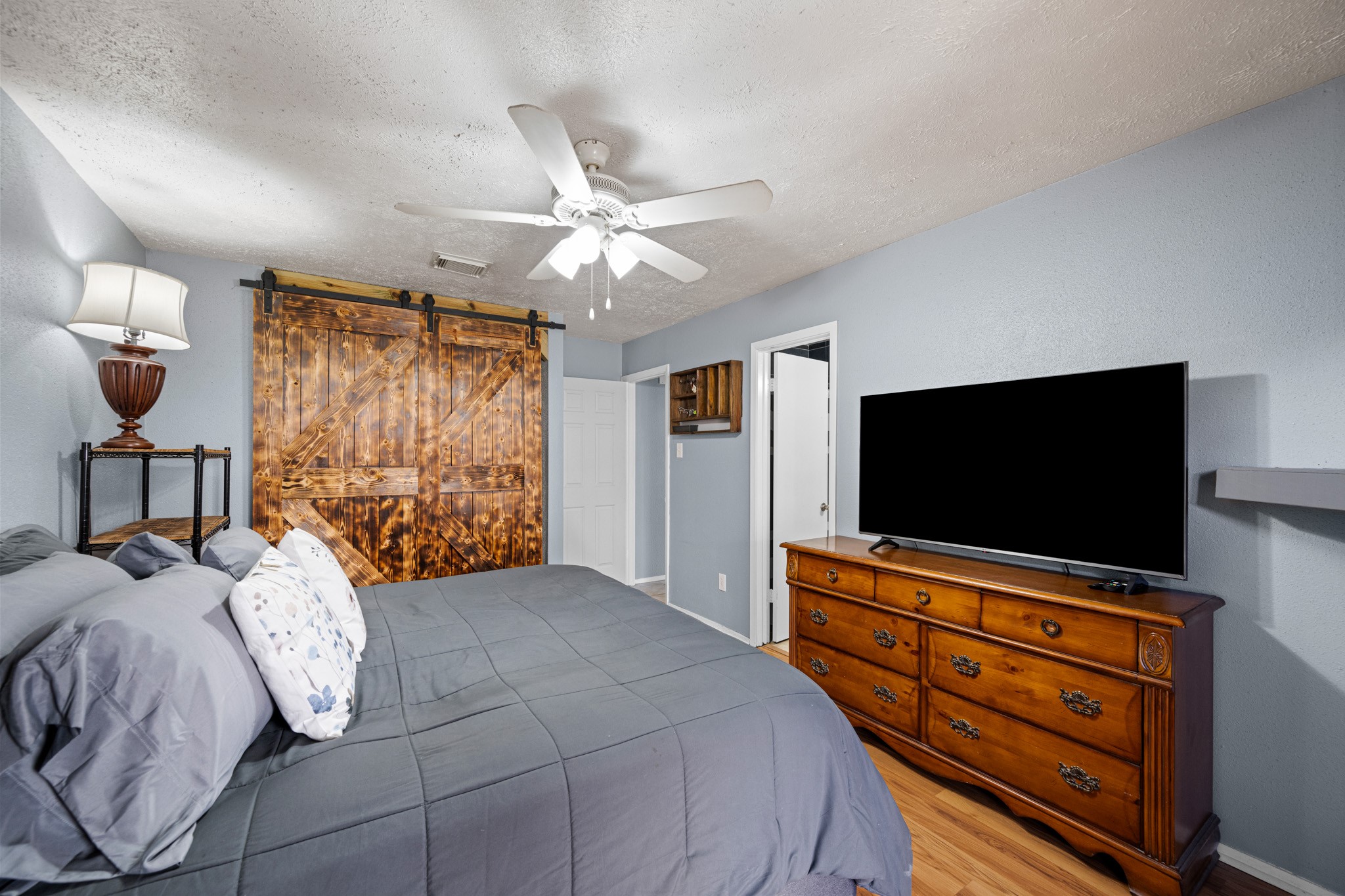 1804 Spruce Drive Rosenberg, TX 77471 - Photo 16 of 29 a bedroom with a bed and a flat screen tv