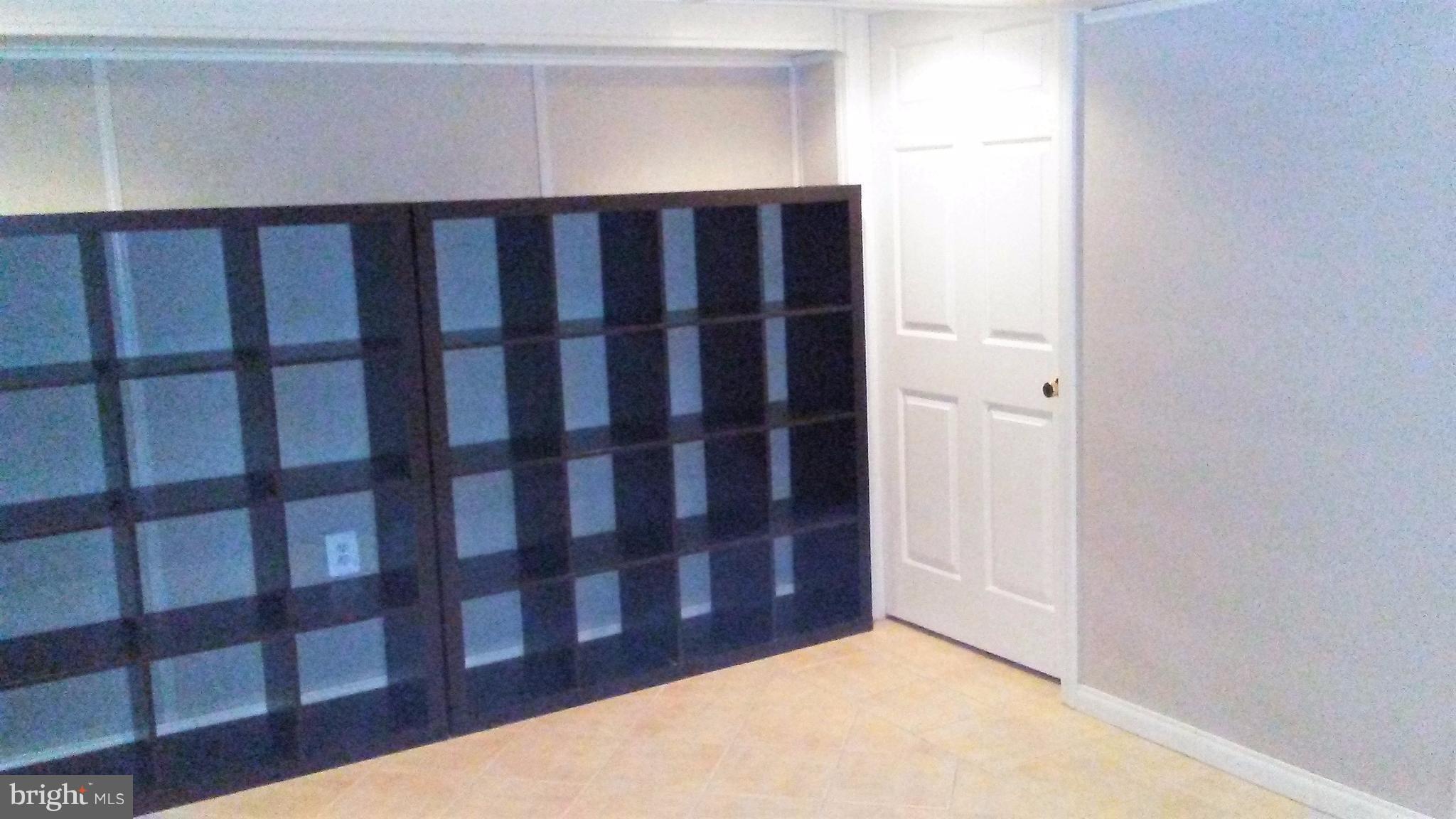 9908 Cherry Tree Lane Silver Spring, MD 20901 - Photo 11 of 15 LL Family room with door to utility room