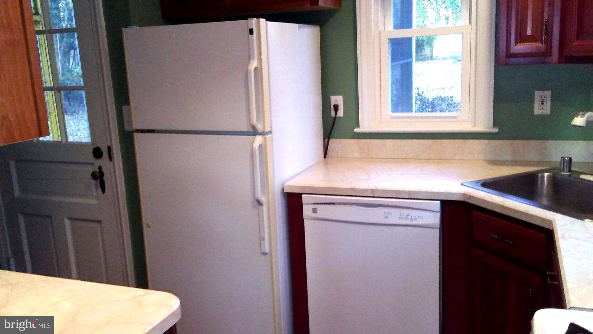 9908 Cherry Tree Lane Silver Spring, MD 20901 - Photo 5 of 15 Nice kitchen with rear door to porch