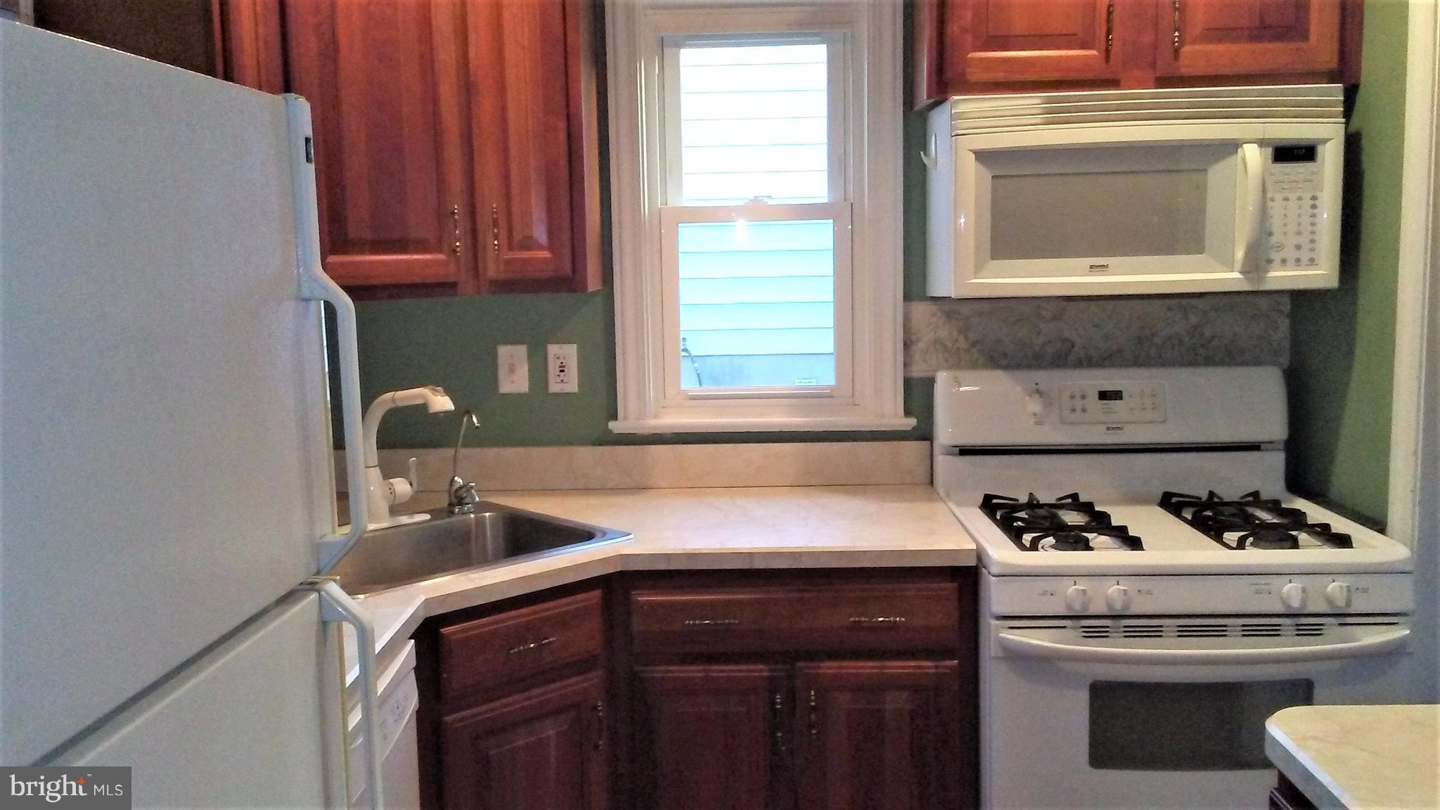 9908 Cherry Tree Lane Silver Spring, MD 20901 - Photo 6 of 15 Kitchen has gas range and built in microwave
