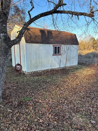 a view of a house with a tree