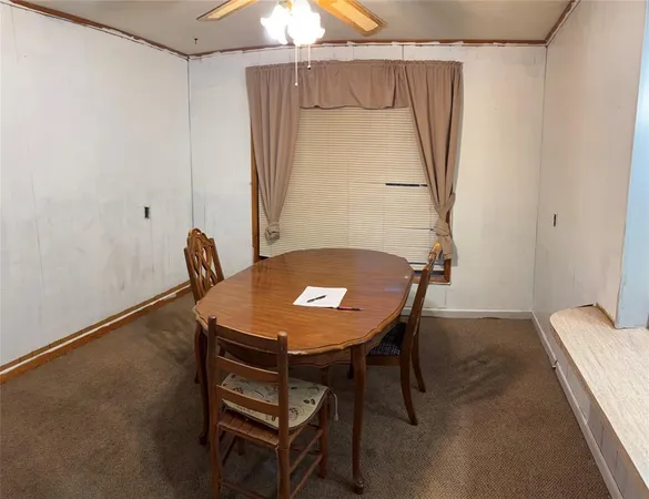 a view of a room with a table and chair