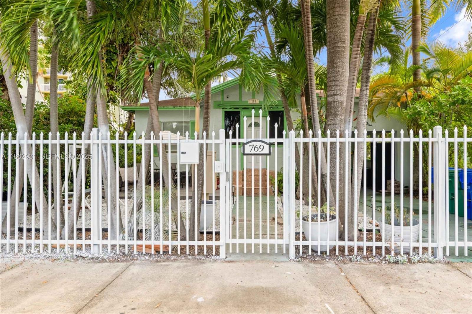 769 Northwest 10th Street Miami, FL 33136 - Photo 6 of 25 a view of a house with a small yard