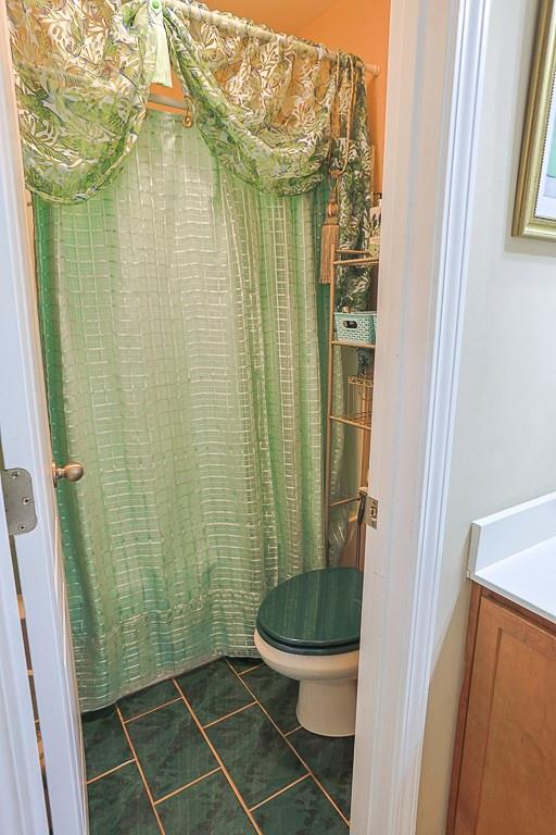 300 Hampton Place Canton, GA 30115 - Photo 37 of 82 a bathroom with a toilet and a shower