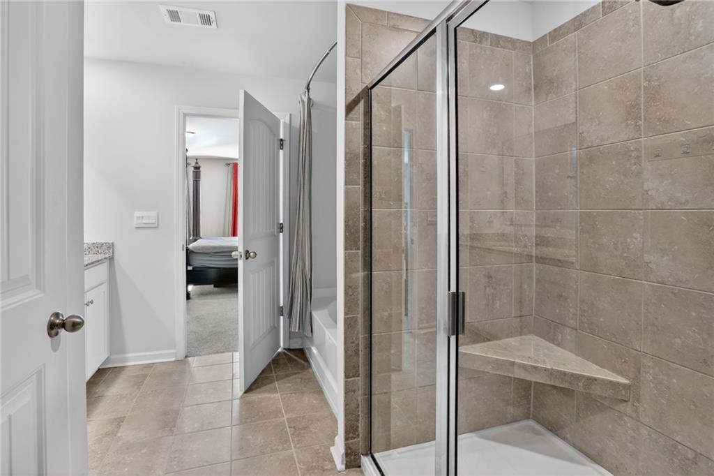 930 Sly Fox Run Fairburn, GA 30213 - Photo 18 of 28 a bathroom with a shower and a sink