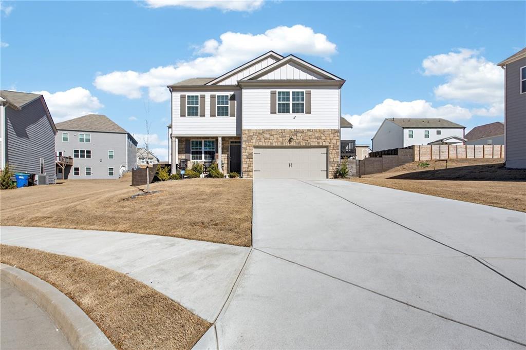 930 Sly Fox Run Fairburn, GA 30213 - Photo 2 of 28 a view of a house with a entertaining space
