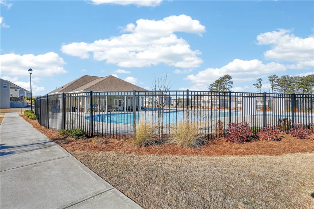 930 Sly Fox Run Fairburn, GA 30213 - Photo 24 of 28 a view of a houses with a lake