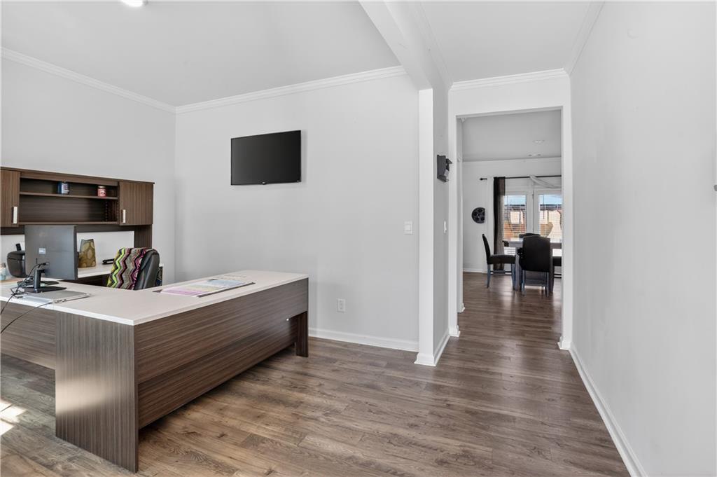 930 Sly Fox Run Fairburn, GA 30213 - Photo 3 of 28 a room with furniture and a flat screen tv